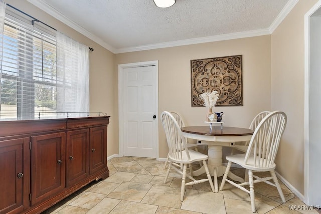 dining room featuring a textured ceiling, ornamental molding, and light tile patterned flooring