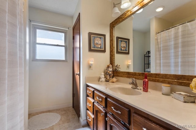 bathroom with vanity and tile patterned flooring