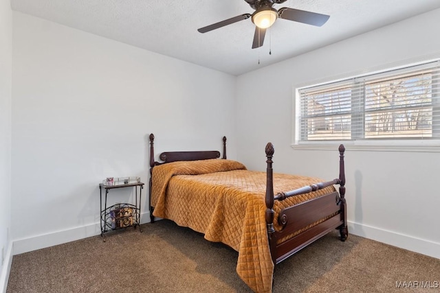 bedroom featuring ceiling fan and dark colored carpet