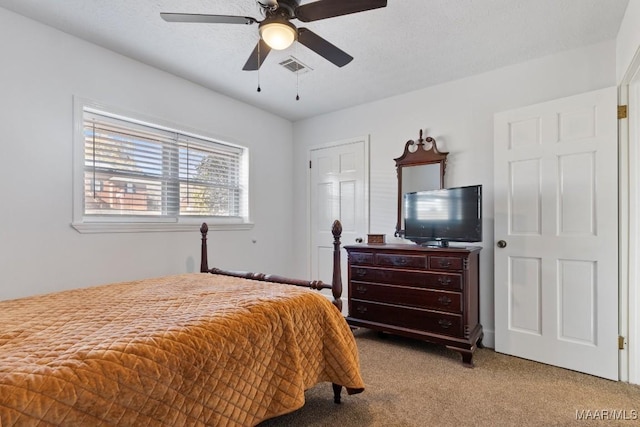 bedroom featuring ceiling fan and light carpet