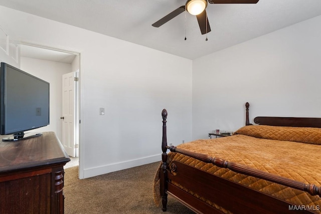 bedroom with ceiling fan and dark colored carpet