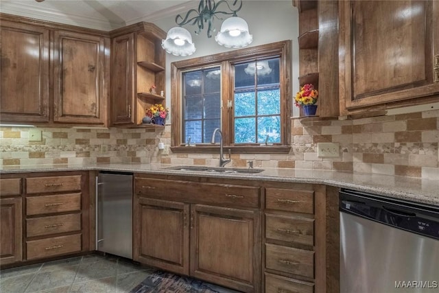 kitchen with pendant lighting, dishwasher, sink, decorative backsplash, and light stone counters