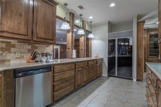 kitchen with pendant lighting, dishwasher, crown molding, built in refrigerator, and decorative backsplash