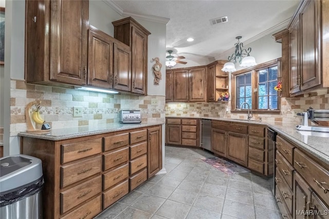 kitchen with pendant lighting, sink, crown molding, light stone countertops, and tasteful backsplash