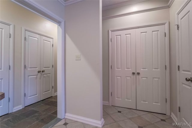 foyer entrance featuring crown molding