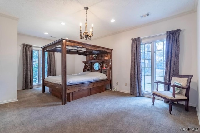 carpeted bedroom featuring a chandelier and ornamental molding