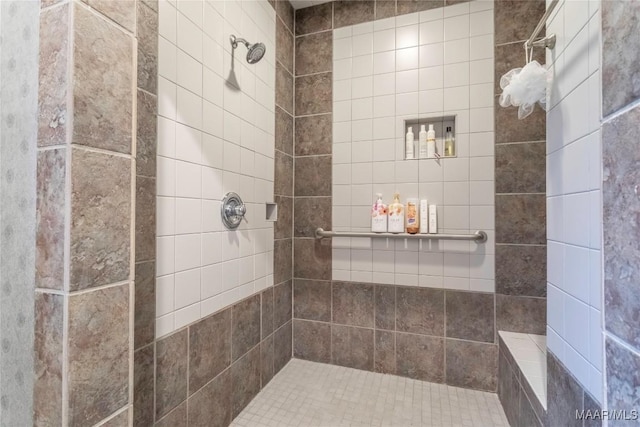 bathroom with tiled shower