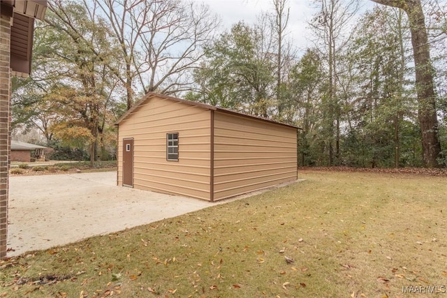 view of outbuilding with a lawn