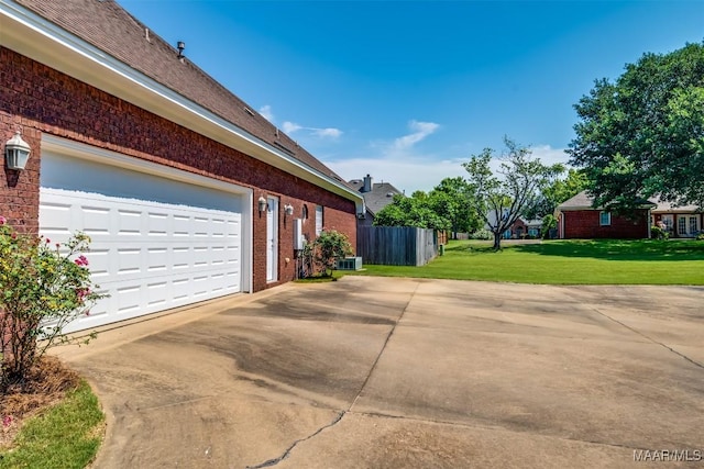 view of side of home with a lawn