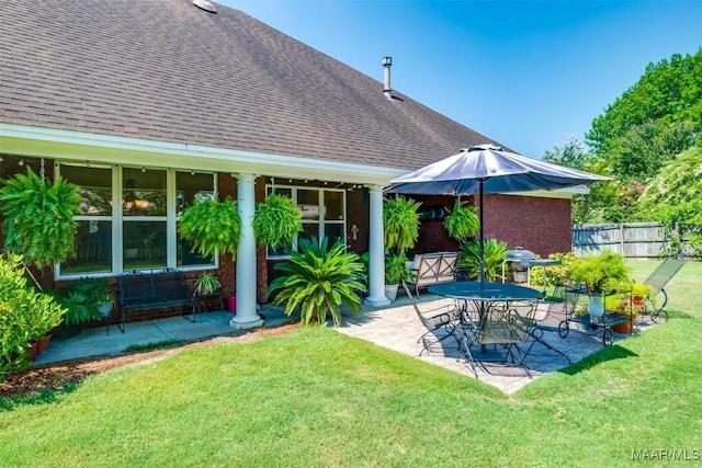 exterior space featuring a yard and a patio