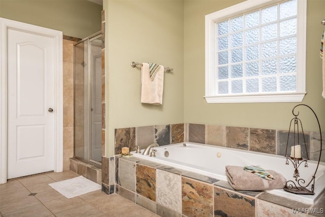 bathroom with tile patterned floors and independent shower and bath