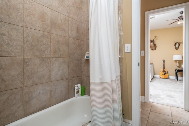 bathroom featuring tile patterned flooring, ceiling fan, and shower / tub combo with curtain