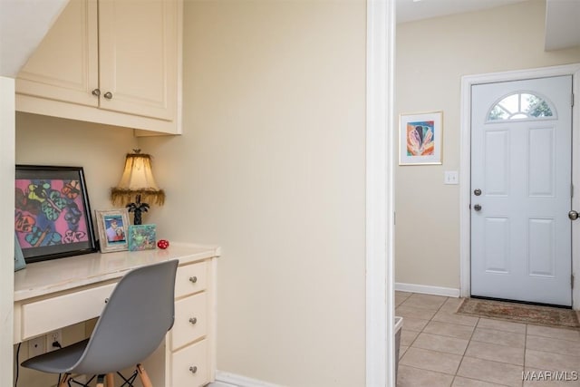 tiled home office featuring built in desk