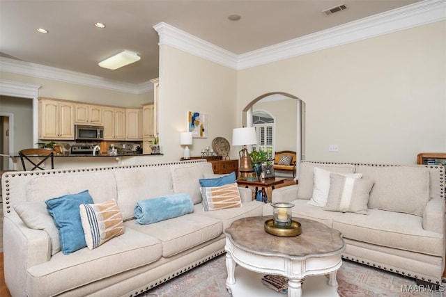 living room featuring crown molding and light tile patterned flooring