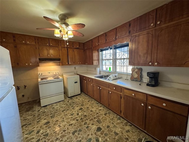 kitchen featuring ceiling fan, sink, and white appliances