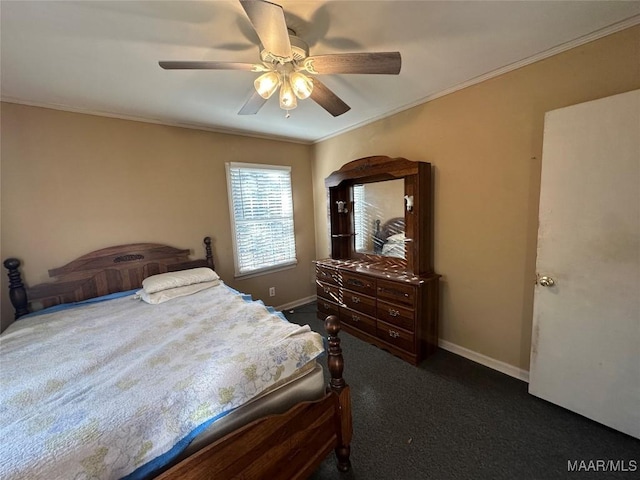 carpeted bedroom featuring ceiling fan and crown molding