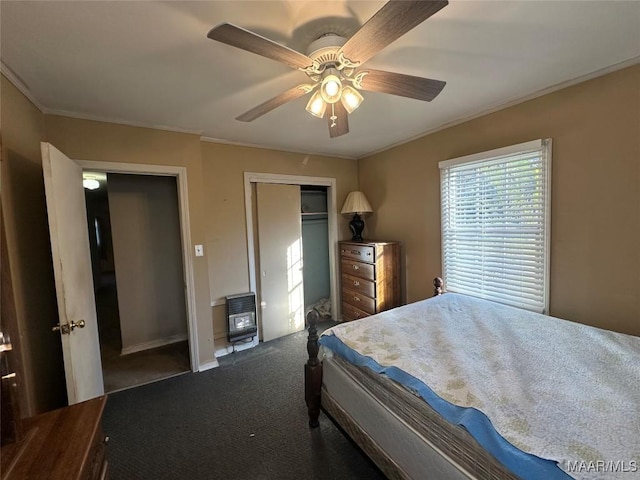 bedroom featuring carpet, heating unit, and ceiling fan