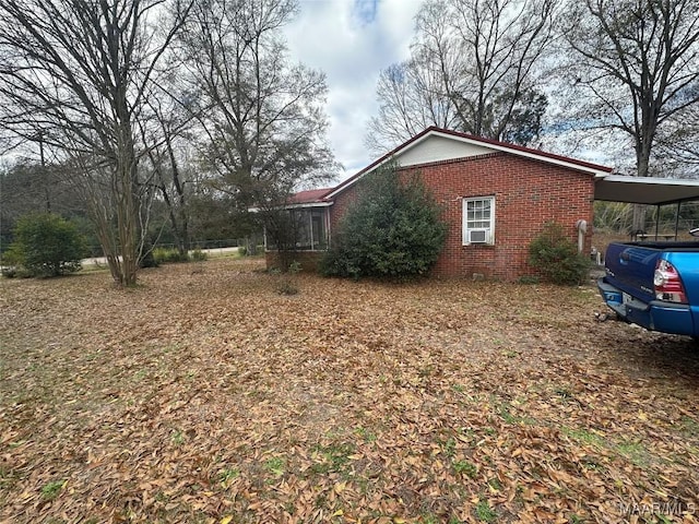 view of side of property featuring a carport