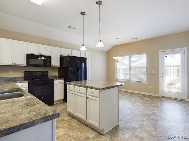 kitchen with pendant lighting, a center island, white cabinetry, and black appliances