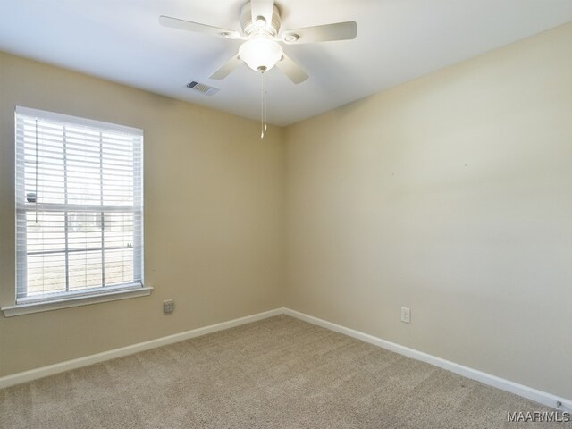 carpeted empty room with ceiling fan