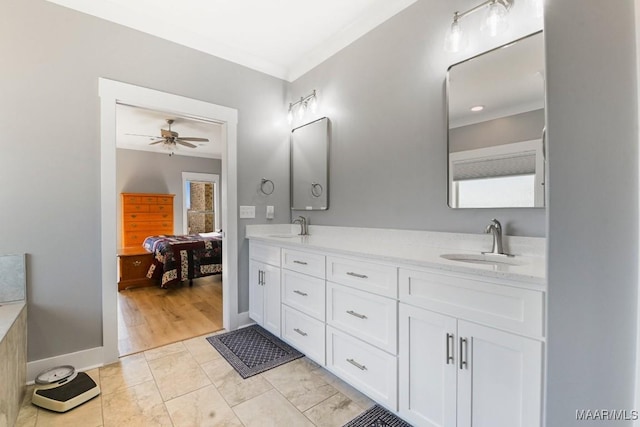 bathroom with tile patterned floors, ceiling fan, and vanity