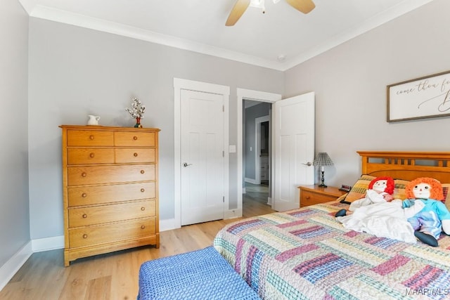 bedroom with ceiling fan, light wood-type flooring, and crown molding