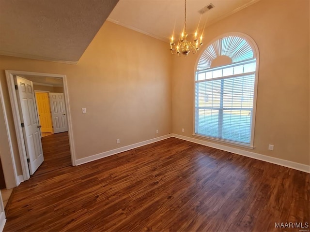 spare room with vaulted ceiling, dark wood-type flooring, and an inviting chandelier