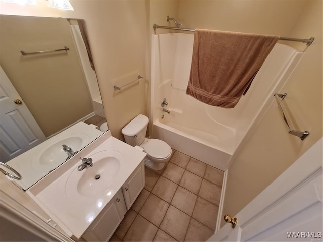 full bathroom featuring tile patterned floors, toilet, vanity, and tub / shower combination