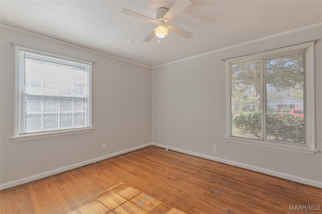 unfurnished room featuring hardwood / wood-style floors, ceiling fan, and ornamental molding