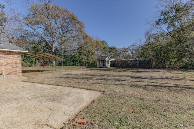 view of yard featuring an outbuilding and a carport