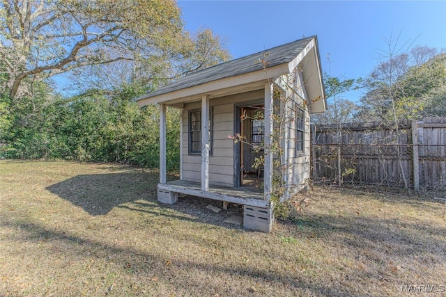 view of outbuilding featuring a yard