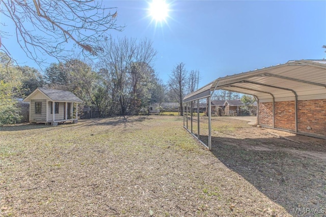 view of yard with a storage unit and a carport