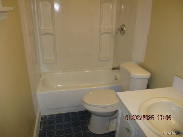 full bathroom featuring shower / bathing tub combination, vanity, and toilet