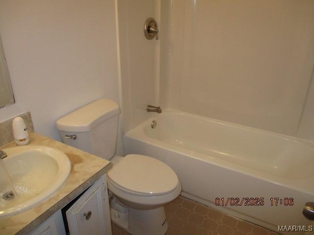 full bathroom with vanity, shower / bathtub combination, and toilet