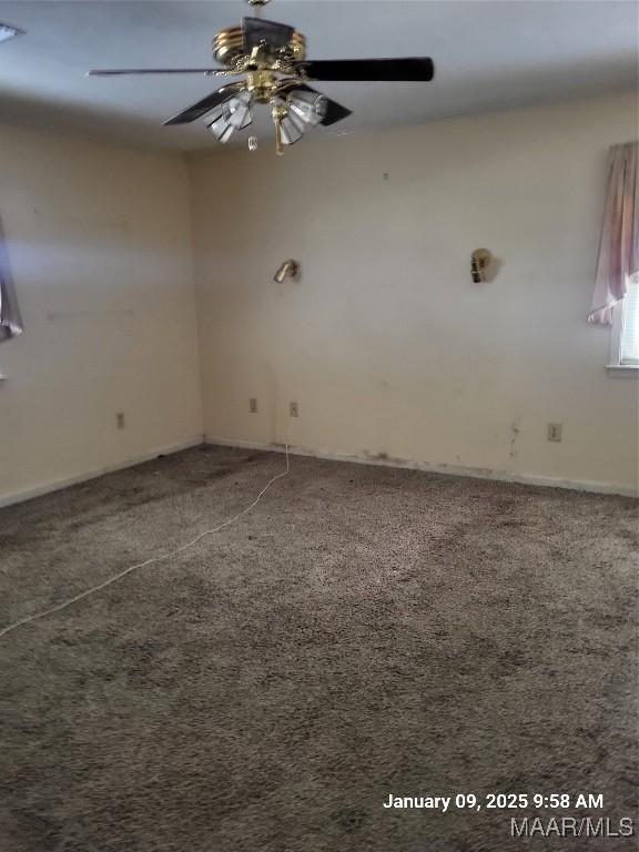 carpeted empty room with ceiling fan