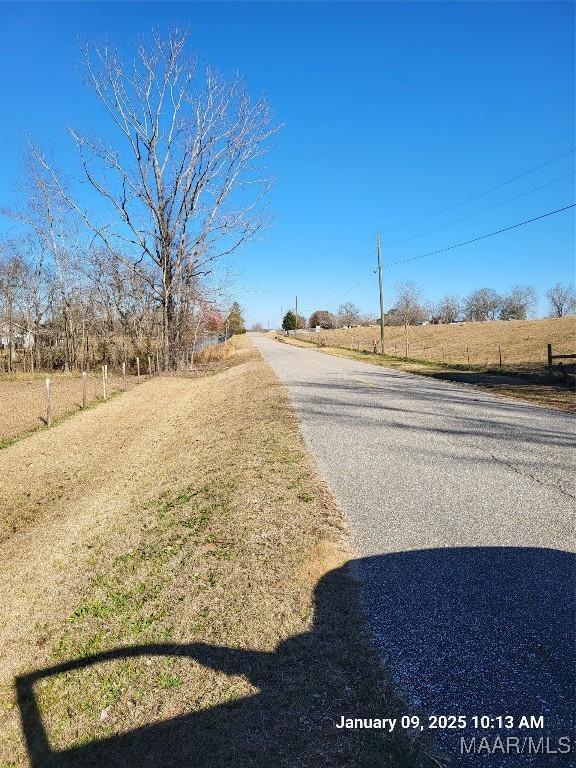 view of street featuring a rural view