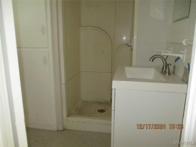 bathroom with vanity and walk in shower