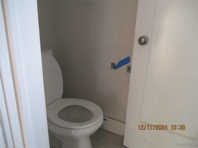 bathroom featuring tile patterned floors and toilet