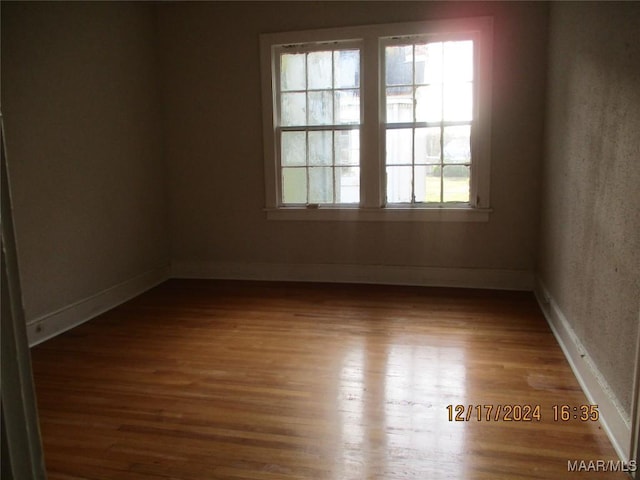 spare room featuring hardwood / wood-style flooring