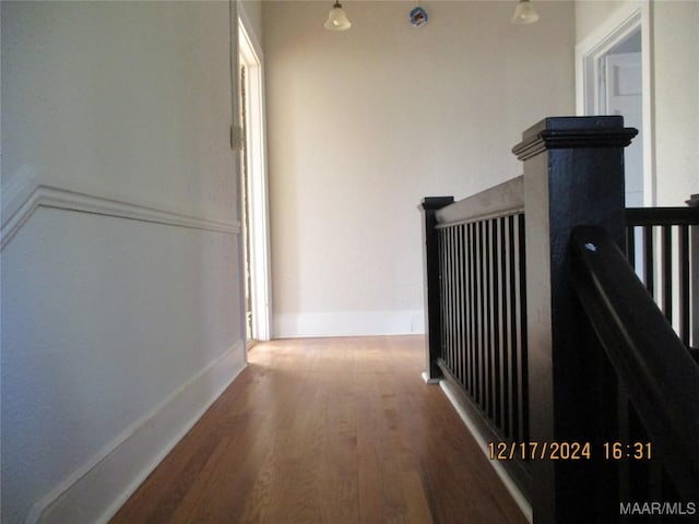 hallway featuring dark hardwood / wood-style flooring