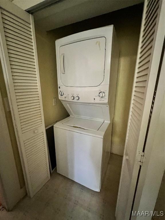 washroom with stacked washer / dryer