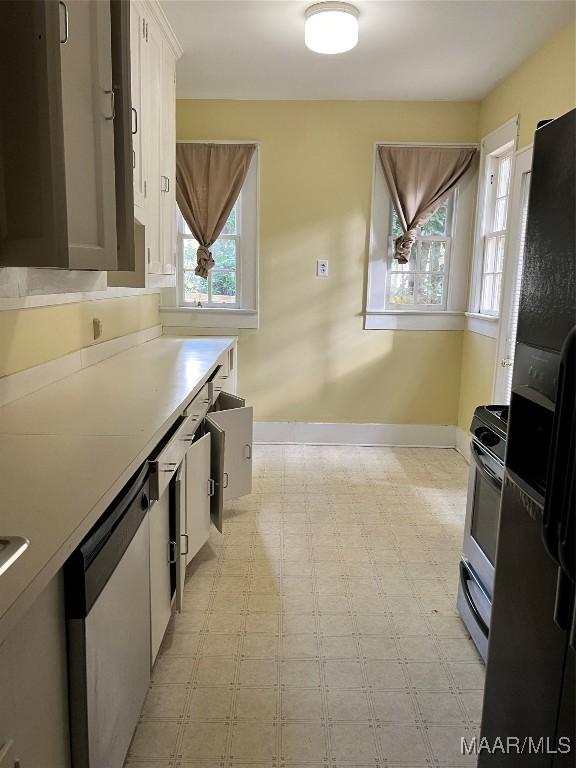 kitchen with white cabinetry and stainless steel appliances