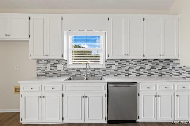 kitchen featuring dishwasher, backsplash, white cabinets, and sink