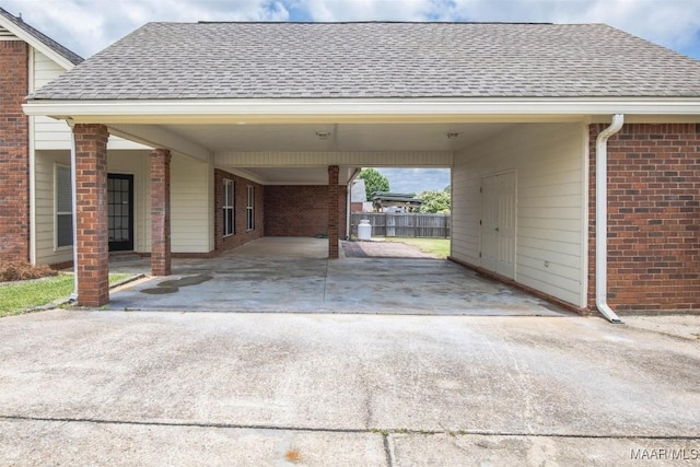 view of vehicle parking featuring a carport