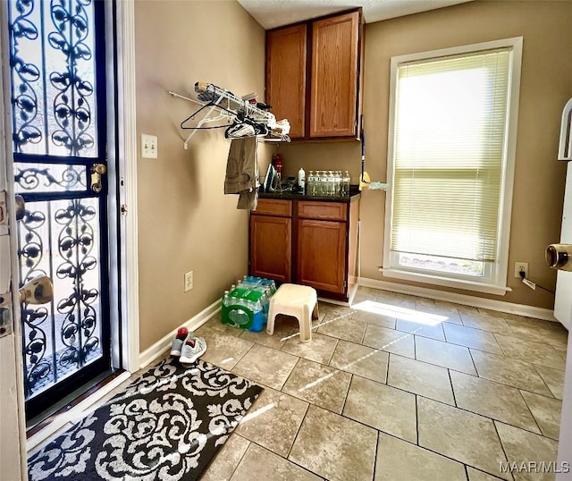 interior space featuring light tile patterned floors