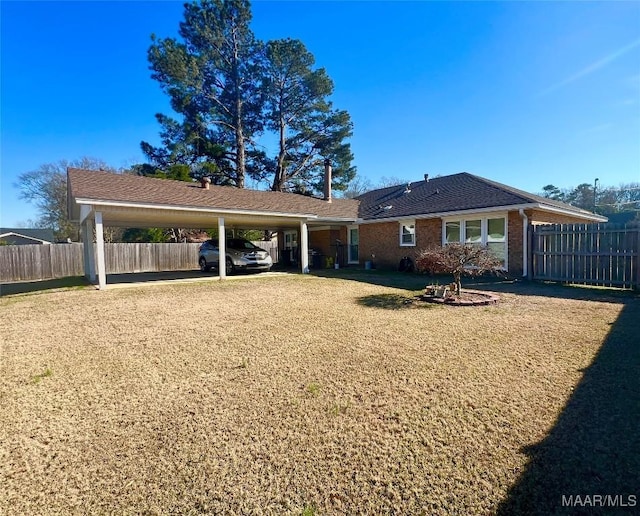 rear view of house with a carport