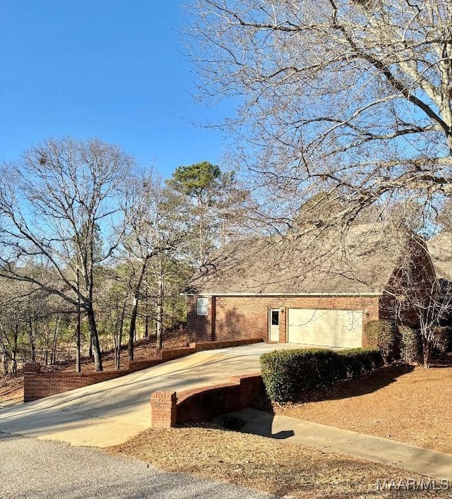 view of property exterior featuring a garage