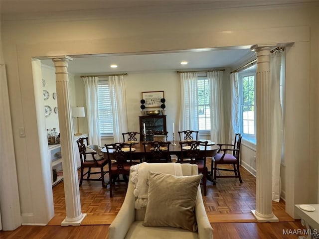 dining area featuring parquet floors