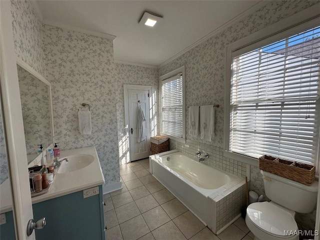 bathroom with tile patterned floors, vanity, ornamental molding, and a bath