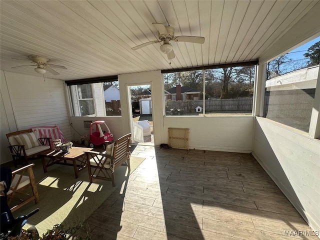 sunroom featuring wood ceiling